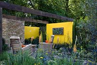 A low maintenance garden created for £13,000. Scented planting. Furniture made from recycled pallets - 'Summer in the Garden' - Silver medal winner - RHS Hampton Court Flower Show 2012 