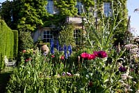 The Sundial Garden and Highgrove House with Papaver somniferum - Poppies, June 2011.