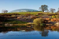 View across Llyn Uchaf to the Great Glasshouse by Sir Norman Foster. National Botanic Garden of Wales, March 2012. 