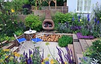 Sunken garden with chiminea and reclaimed scaffolding boards used as decking. Our First home Our first garden, Hampton Court Palace  flower show 2012