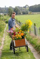 Martin Heutink with a trolley of organic flowers for his clients at nursery Bloemrijk