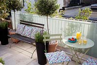 Small London garden with table and drinks
