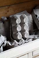 Empty egg boxes for customers to use and recycle - Annabel's Egg Shed, Cavick House Farm, Norfolk