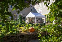 Annual pumpkin festival, market stalls seen from potier - Chateau du Rivau, Lemere, Loire Valley, France