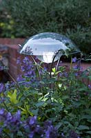 Solar powered garden light, lit at dusk