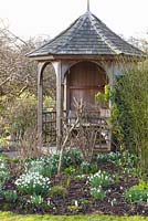 Rustic gazebo and bed of Galanthus - Dial Park
