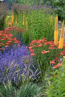 Colourful planting combination of perennials and grasses including Achillea and Eremurus - Floriade 2012