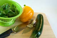 Fresh vegetables and Basil leaves in colander
