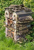 Insect house composed of brick, terracotta and wood