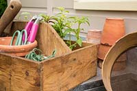 Potting bench and assorted gardening tools
