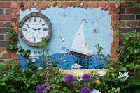 Home made nautical themed garden frieze incorporating a weather station