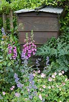 Old working beehive set into bee-friendly garden border - Open Gardens Day 2013, Walberswick, Suffolk