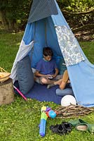 Childrens teepee in garden setting