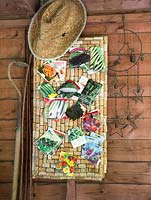 Cork board with hanging seed packets