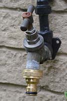 Outside tap fitted with a hose connector