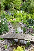 Wooden bridge over stream