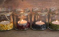 Decorative display of candles using Mung beans, Kidney beans, Split peas and Black beans