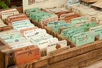 Seed bags filed in old wooden box 