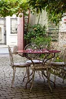 Table and chairs in restaurant garden, St Aignan, Loire Valley, France