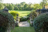 View across surrounding fields from the Conservatory terrace, framed by clipped rosemaries