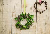 Alnus wreath and ivy wreath hanging on wooden door