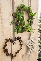 Alnus wreath and ivy wreath hanging on wooden door