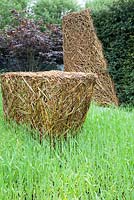 Willow sculpture by Emma Stothard in drift of barley. As Nature Intended Garden, Chelsea Flower Show 2013
