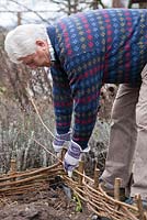 Making a hazel fence on a raised vegetable bed. Step by step.