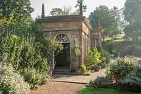 Orangery, built 1968, at the end of the Fountain Court, surrounded by lavender. Mapperton House, Beaminster, Dorset, UK