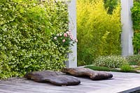 Wooden boards on decking beside swimming pool