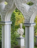 The exedra with statue behind. Painswick Rococo Garden, Gloucestershire 