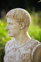 Bust of Julius Caesar next to the exedra. Painswick Rococo Garden, Gloucestershire 