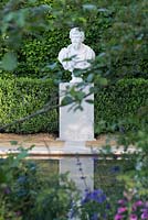 Statue reflected in peaceful pond - The BrandAlley Garden, designer Paul Hervey-Brookes - RHS Chelsea Flower Show 2014
