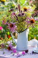 Jug of perennials. Echinacea purpurea, Persicaria 'Firetail', Verbena bonariensis, Foeniculum, Perovskia.