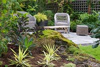 Garden border with view to outdoor seating area. Hakonechloa. Victoria BC, Canada