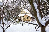 The Sanctuary covered in snow. Highgrove Garden, January 2013. It was built in 1999 to mark the Millennium and is a place of contemplation. Devised by Professor Keith Critchlow of the Prince's school of Tradtional Arts and Crafts and created from a design by Charles Morris. It is made entirely of natural materials.