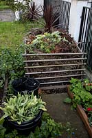Compost heap in front garden, Brixton
