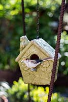 Ceramic bird house and decorative bird
