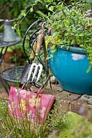 Display of tools and container planting. 