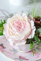 Pink rose in an arrangement. Rose 'Keira' a cut flower variety from David Austin Roses