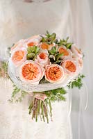 Peach roses in a wedding arrangement. Rose 'Juliet' a cut flower variety from David Austin Roses