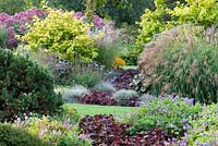 Mixed borders at Foggy Bottom, Bressingham Gardens, Norfolk, UK in September.