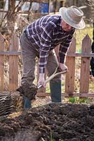 Early spring preparation of vegetable beds. Forking.