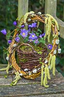 Wicker baskets with Anemone blanda and a decorative Wreath made from Pussy willow, Catkins and Willow