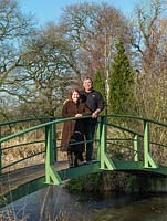 Chris and Sheila Bissell in their garden with Monet inspired bridge.