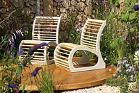 Wooden chairs on circular raised wooden platform