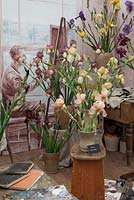 Artists's studio with cut flowers in jugs and pots. Irises of Sir Cedric Morris and Associates, RHS Chelsea Flower Show, 2015