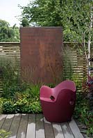 Slatted fencing with panel feature and O-nest Chair by Tord Boontje - Foundation for Growth Garden, RHS Hampton Court Palace Flower Show 2015