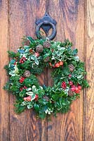 Christmas wreath mounted on a door.