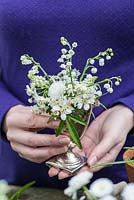 All white posie step by step in May: Mexican orange blossom, Bellis daisy, cow parsley, white grape hyacinths, hawthorn  and lily-of-the-valley. Choisya 'Aztec Pearl', Bellis perennis, Anthriscus sylvestris, Muscari aucheri 'White Magic', Crataegus laevigata and Convallaria majalis.